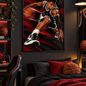 May include: A framed wall art print featuring a basketball player in a black and white uniform mid-action, dribbling a basketball against a dynamic red and black background. The player wears a black arm sleeve, white socks, and black and white trainers.