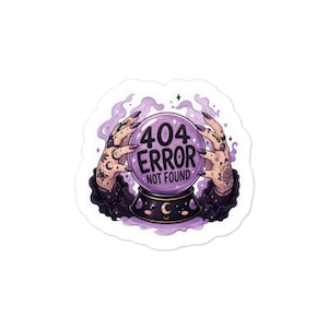 May include: A sticker featuring a purple crystal ball held by two tattooed hands. The crystal ball displays the text 404 ERROR NOT FOUND in black letters. The design includes swirling purple smoke, small stars, and a dark base with a crescent moon.