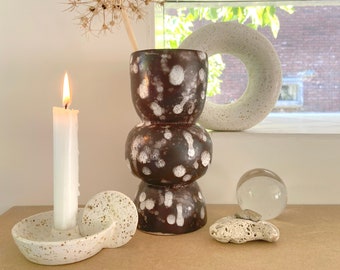 Stacked vase L chocolate brown with white spatter pattern.