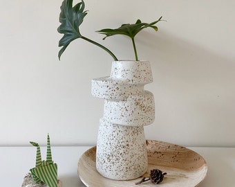 A-symmetrical vase white with brown speckled glaze