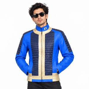 May include: A blue jacket with a stand-up collar featuring the number 33 in white. The jacket has a central gold vertical panel, dark blue quilted chest sections, and quilted shoulder panels. It includes a full-length front zipper closure.