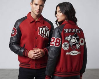May include: A red and black varsity jacket featuring black sleeves, a button-up front, and ribbed cuffs. The front displays the letters MM. The back features a Mickey Mouse graphic, the text MICKEY, the number 28, and the word Classic.