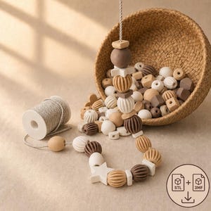 May include: A collection of silicone beads in shades of brown, tan, and white, featuring round, ribbed, and star-shaped designs. A woven basket holds loose beads, while a string of beads is threaded on a cord next to a spool of white twine.