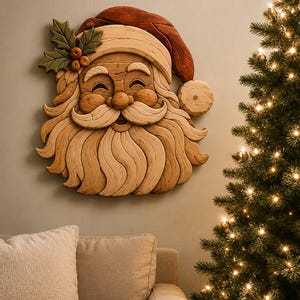 May include: A wall-mounted wooden Santa Claus face carving featuring a natural light wood finish for the beard and mustache, a deep red wooden hat, and green holly leaves with brown berries attached to the side of the hat brim.