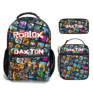 May include: A backpack, a pencil case, and a lunch bag set featuring a colorful Roblox grid pattern. The backpack and lunch bag display the name DAXTON in white block letters. The backpack includes side mesh pockets and a front zippered compartment.