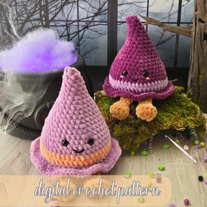 May include: Two plush crochet figures shaped like pointed hats with smiling faces and small tan feet. One figure is light purple with an orange band, and the other is dark purple with a lighter purple band. Text reads digital crochet pattern.