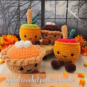 May include: Four plush crochet toys featuring two round orange fruits with green stems and two round pies with textured crusts. Each toy has a smiling face with black eyes and small pink cheeks. The text digital crochet pattern bundle is visible.