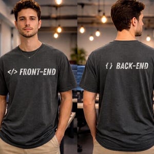 May include: A dark gray short-sleeve t-shirt featuring the white text FRONT-END with a code bracket symbol on the chest and the white text BACK-END with a curly bracket symbol on the back. The shirt has a crew neckline and a relaxed fit.