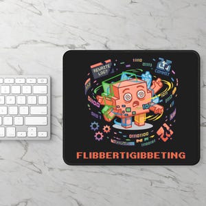 May include: A black rectangular mouse pad featuring a pixel art illustration of a confused orange block-shaped character with swirling eyes, surrounded by floating binary code, gears, and text that reads REWRITE LOG?, COMMIT, and FLIBBERTIGIBBETING.