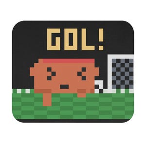 May include: A rectangular mouse pad featuring a pixel art graphic of a brown character on a green checkered field next to a white soccer goal. The text GOL! is printed in large yellow pixelated letters against a solid black background.