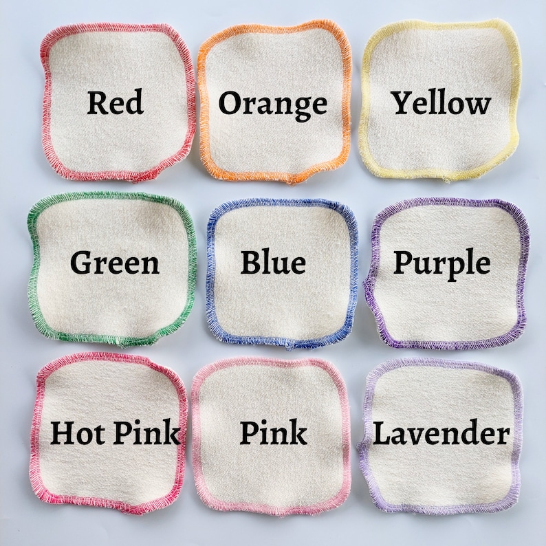 May include: Nine cotton rounds with coloured stitching, each labelled with a colour: Red, Orange, Yellow, Green, Blue, Purple, Hot Pink, Pink, and Lavender.