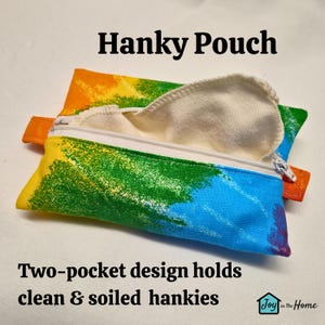 May include: A colourful fabric pouch with a zipper closure and two pockets. The pouch is designed to hold clean and soiled handkerchiefs. The text "Hanky Pouch" and "Two-pocket design holds clean & soiled hankies" is printed on the image.