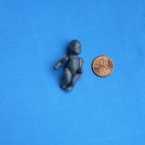 Dollhouse miniature porcelain black baby doll kit 1:12 scale 1 3/4 "  doll's doll unpainted.
