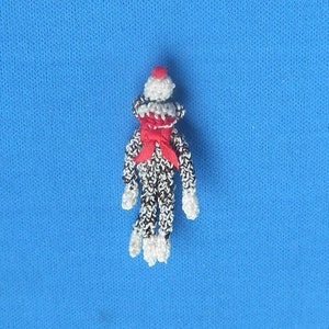 May include: A set of three ceramic mugs with a speckled, matte finish. The mugs are in shades of cream, light gray, and dark gray. Each mug has a simple, minimalist design, perfect for coffee or tea.