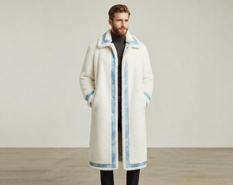 May include: A long, off-white faux fur coat featuring a wide collar and a front button closure. The coat is accented with light blue denim-style trim along the lapels, the front opening, the sleeve cuffs, and the bottom hem of the garment.