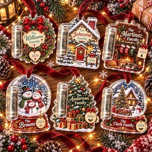 May include: Six personalized acrylic Christmas ornaments with red velvet ribbons, each featuring a clear tube for holding currency, festive holiday scenes, family names, and the year 2026 printed on small hanging tags.