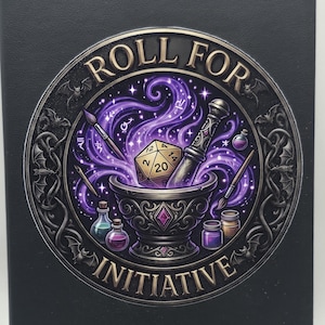 May include: A black notebook featuring a circular graphic with the text "ROLL FOR INITIATIVE". The design depicts a mortar and pestle, a twenty-sided die, paintbrushes, and potion bottles surrounded by swirling purple magical energy and bats.