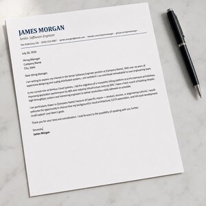 May include: A white sheet of paper featuring a printed cover letter for a Senior Software Engineer position, addressed from James Morgan, accompanied by a black ballpoint pen resting on the right side of the document with dark blue text.