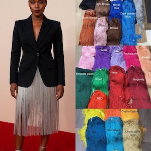 May include: A black blazer with a single button closure paired with a silver fringe skirt. The image includes a color chart displaying various fringe fabric options labeled with names such as white, cream, navy blue, grey, brown, onion, purple, lilac, fuchsia pink, peach, emerald green, red, wine, burgundy, custard yellow, teal, mint green, champagne gold, and gold.
