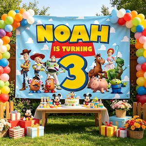 May include: A birthday party backdrop featuring the text NOAH IS TURNING 3 with Toy Story characters including Woody, Buzz Lightyear, Jessie, and Mr. Potato Head. The banner is framed by a colorful balloon arch and sits above a table with a cake.