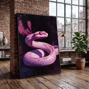May include: A rectangular framed wall art piece featuring a detailed illustration of a coiled snake with vibrant pink scales and red markings. The snake is set against a dark, moody background with deep purple and black tones, enclosed in a thin black frame.