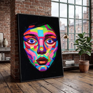May include: A rectangular framed wall art piece featuring a vibrant, multi-coloured mosaic-style portrait of a face against a solid black background. The face is composed of geometric shapes in bright shades of pink, blue, yellow, green, and purple.