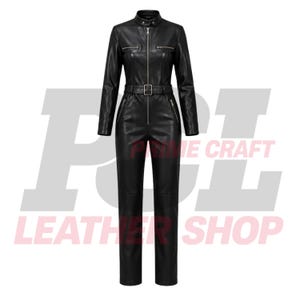May include: A black leather jumpsuit featuring a high collar with a snap button, a full-length front zipper, long sleeves, and a matching belt at the waist. The garment includes two horizontal zippered chest pockets and two angled zippered hip pockets.