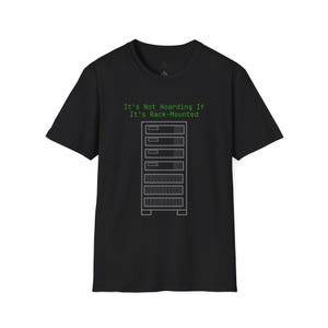 May include: A black short-sleeved t-shirt featuring a graphic of a server rack in light gray lines. Above the server rack, the text "It's Not Hoarding If It's Rack-Mounted" is printed in a bright green, monospaced, computer-style font.