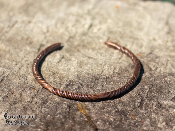 Hand hammered twisted copper torc bracelet finished with a beautiful aged patina