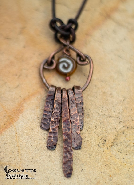 Hand Forged Paddle Pendant with Resin Fossil Bead on a Leather Cord