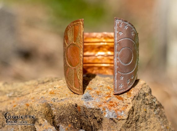 Hand hammered and fold formed copper cuff bracelet finished with a beautiful golden patina