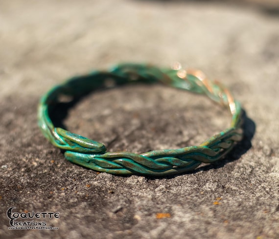 Hand hammered woven copper torc bracelet finished with a beautiful ancient green patina