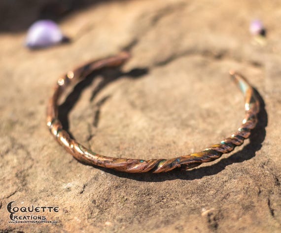 Hand hammered twisted copper torc bracelet finished with a beautiful aged patina