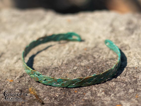 Hand hammered woven copper torc bracelet finished with a beautiful ancient green patina