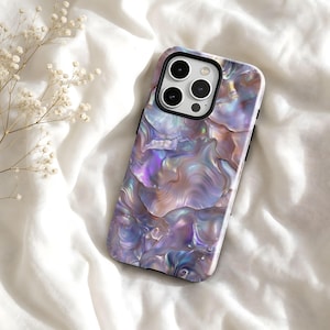 May include: A smartphone case featuring an iridescent, pearlescent shell pattern with swirling shades of purple, blue, and soft pink. The case has a black camera cutout frame and covers the back and sides of the device with a glossy finish.