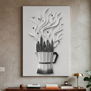 May include: A vertical wall art piece featuring a white moka pot base with a black handle. Rising from the pot is a black silhouette of a city skyline, transitioning into swirling white paper-like smoke plumes with small black coffee beans and birds.