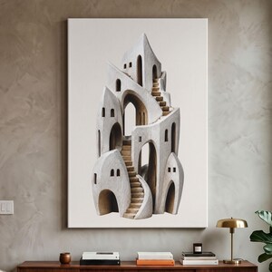 May include: A vertical wall art print featuring a sculptural, off-white architectural structure with multiple levels, arched doorways, and winding staircases. The design displays a textured, stone-like finish with deep shadows within the openings.