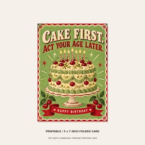 May include: A rectangular greeting card with a green background featuring a white cake on a pedestal stand, topped with cherries and six lit candles. The text reads CAKE FIRST. ACT YOUR AGE LATER. and HAPPY BIRTHDAY on a red banner below.