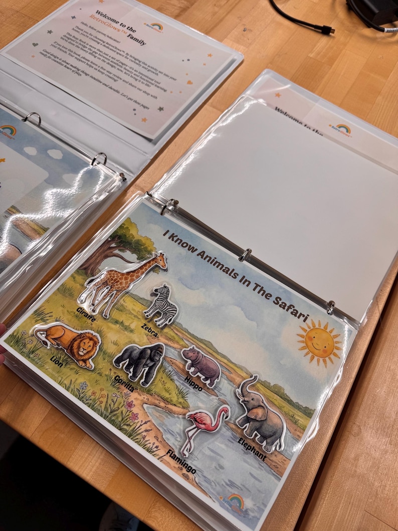 May include: A three-ring binder containing educational activity pages. One page titled I Know Animals In The Safari features illustrations of a giraffe, zebra, lion, gorilla, hippo, flamingo, and elephant, with a smiling sun in the corner.