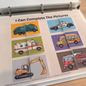 May include: A binder page titled I Can Complete The Pictures featuring six matching activities with illustrations of a garbage truck, police car, ambulance, school bus, and excavator. Each vehicle is split into two parts for a puzzle game.