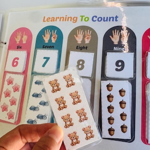 Counting activity page "Learning To Count" from 6 to 10, showing a child's hand matching number-themed cutouts.
