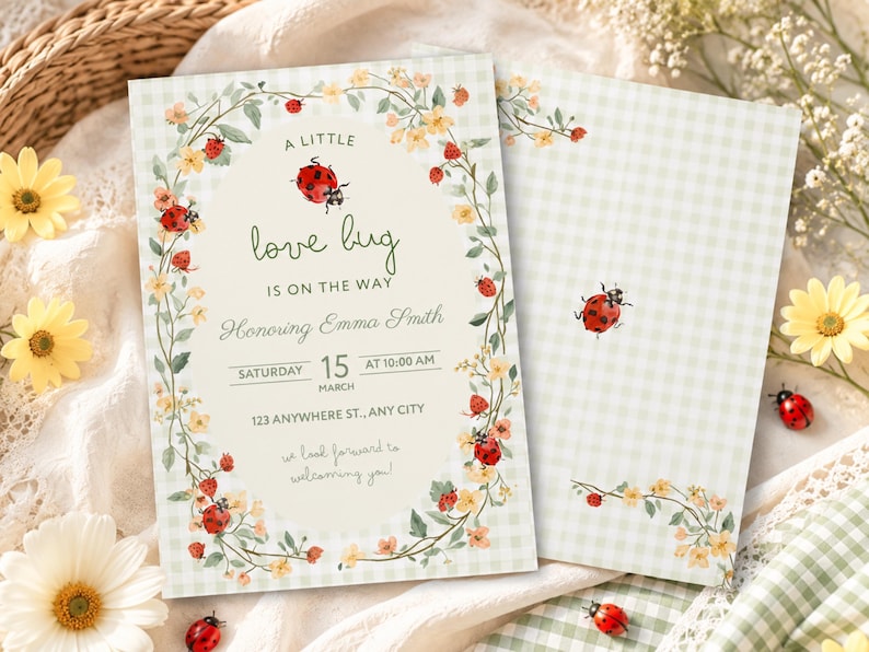 May include: A rectangular baby shower invitation card featuring a light green gingham background and a central oval frame decorated with watercolor illustrations of ladybugs, yellow flowers, and green vines. The text reads A LITTLE love bug IS ON THE WAY, Honoring Emma Smith, SATURDAY 15 AT 10:00 AM, MARCH, 123 ANYWHERE ST., ANY CITY, and we look forward to welcoming you.