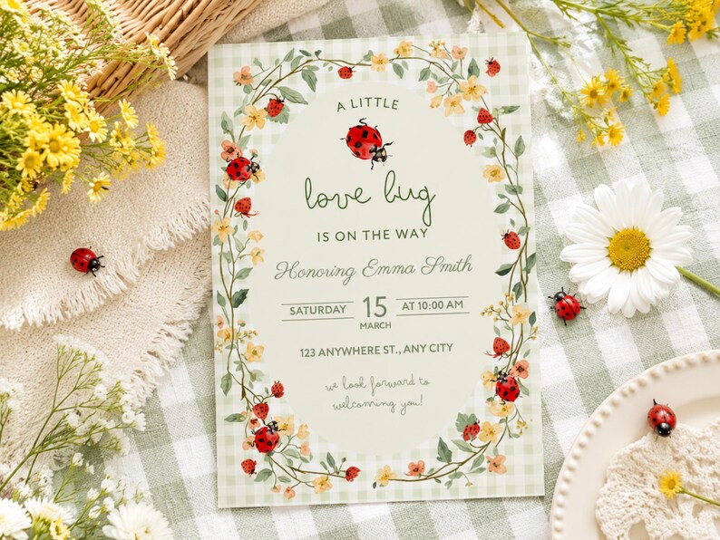 May include: A rectangular baby shower invitation card featuring a light green gingham background and an oval center. The text reads A LITTLE love bug IS ON THE WAY Honoring Emma Smith SATURDAY 15 MARCH AT 10:00 AM 123 ANYWHERE ST., ANY CITY.