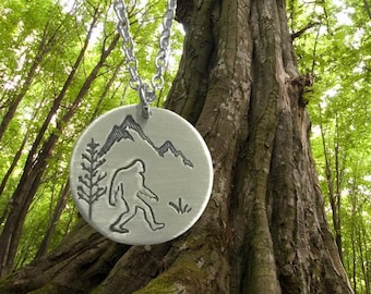 Sasquatch Bigfoot circular pendant necklace in silver color