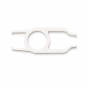 May include: A white plastic contact lens insertion and removal tool. The device features a central circular ring handle with two parallel prongs extending from one side and two curved, inward-facing prongs on the opposite side for handling.