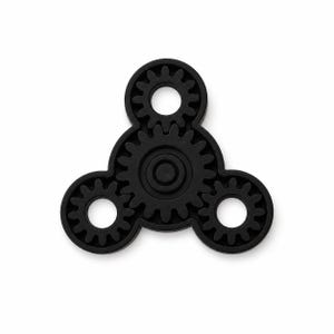 May include: A matte black fidget spinner featuring a central gear design surrounded by three smaller gear-shaped arms. The object has a circular center hub and a mechanical aesthetic with visible teeth along the edges of each circular component.