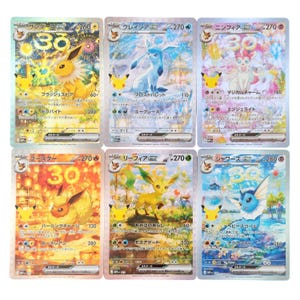 May include: A collection of six holographic Pokemon trading cards featuring Jolteon, Glaceon, Sylveon, Flareon, Leafeon, and Vaporeon. Each card displays a unique character illustration, Japanese text, numerical values, and a 30th anniversary logo.