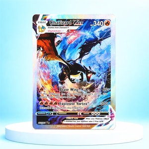May include: A Charizard VMAX trading card featuring a holographic finish with a dynamic illustration of the fire-type creature. The card displays 340 HP, the Brave Wing and Explosive Vortex attacks, and includes official text and symbols.