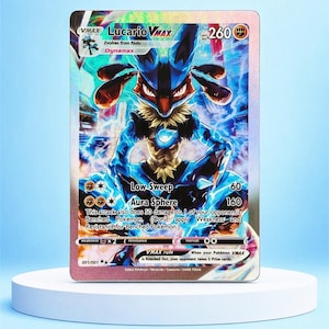 May include: A Lucario VMAX trading card featuring a holographic finish with blue and black character artwork. The card displays the text Lucario VMAX, 260 HP, and lists attacks Low Sweep and Aura Sphere with associated damage values and game rules.