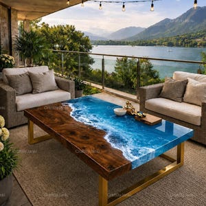May include: A rectangular coffee table featuring a natural wood slab with a live edge and a blue resin inlay that mimics ocean waves with white foam details. The table is supported by a gold-colored metal frame and sits between two wicker chairs.